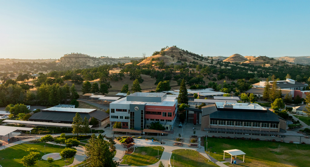 Aerial view of campus with the buttes in the background.