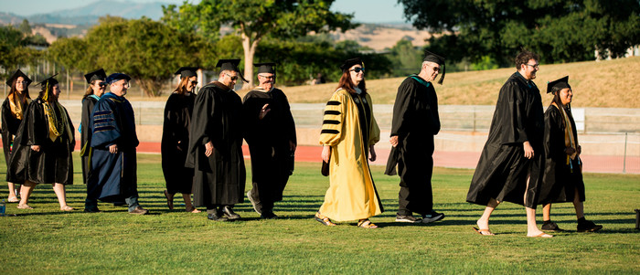 Leadership team walks in at commencement.