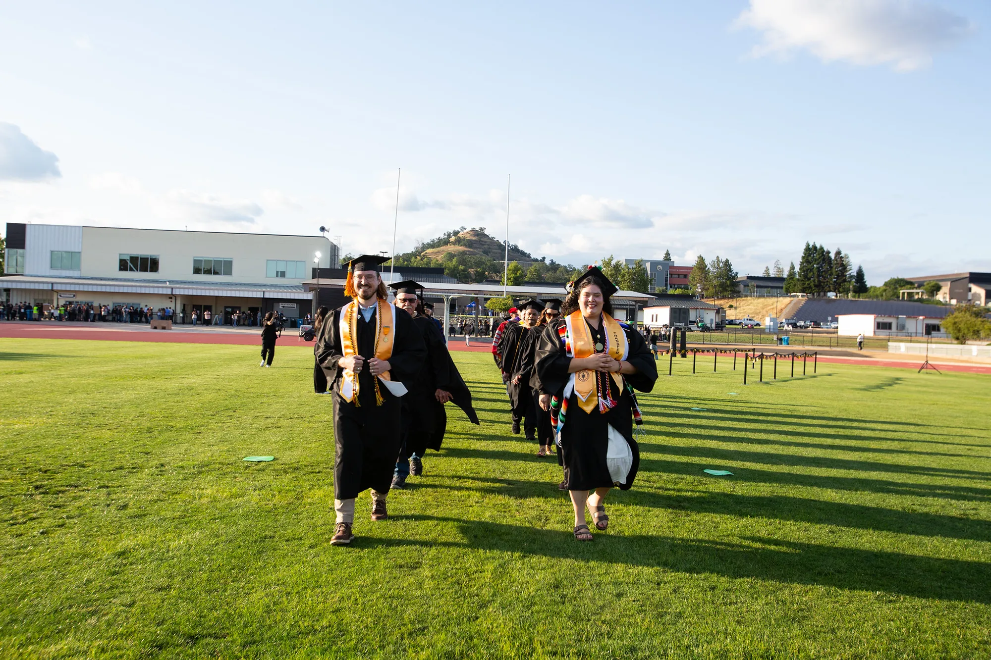 butte college graduates arrive at commencement.