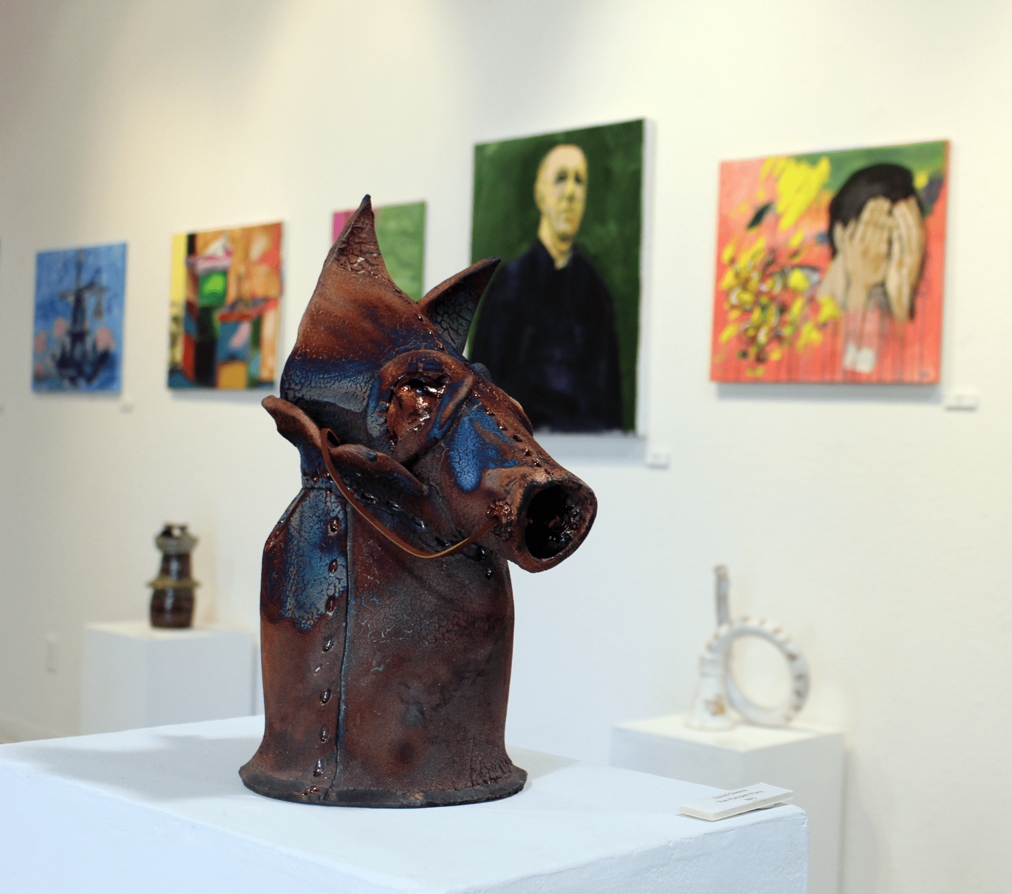Image of a rusty and blue horsehead sculpture at the BC art gallery