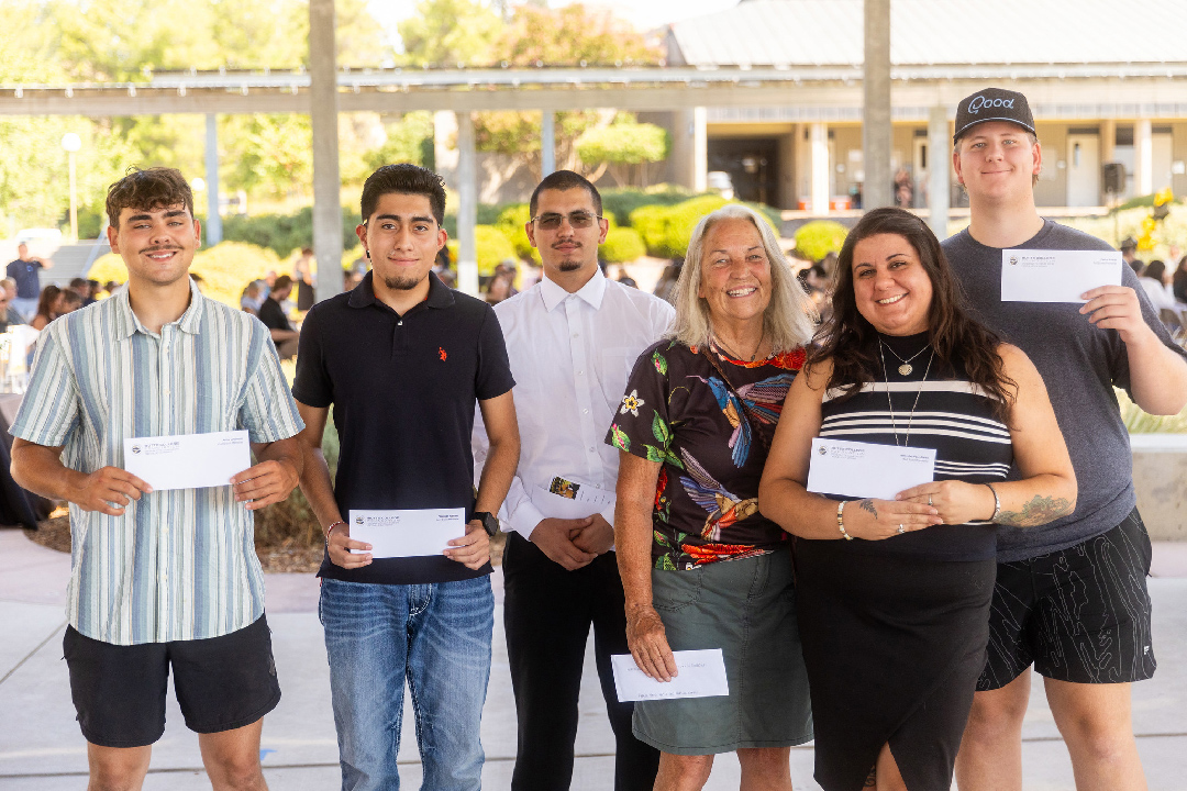 Students at Butte College pose with their scholarship checks. 