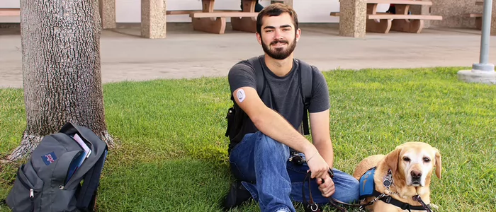 dsps-student-on-lawn-with-guide-dog